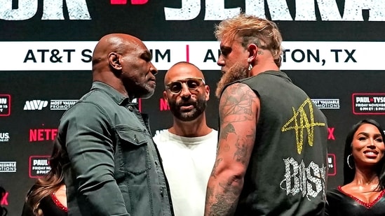 US boxer Mike Tyson (L) and US boxer-actor Jake Paul (R) face each other. (AFP)