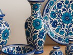 A curated display of Jaipur blue pottery, blending traditional craftsmanship with modern appeal, perfect for adding charm to any space.