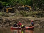 HUNT, TEXAS - JULY 7: Search and rescue workers use a sonar device while paddling down the Guadalupe River in a boat looking for survivors or the remains of victims swept up in the flash flooding on July 7, 2025 in Hunt, Texas. HUNT, TEXAS - JULY 7: Search and rescue workers use a sonar device while paddling down the Guadalupe River in a boat looking for survivors or the remains of victims swept up in the flash flooding on July 7, 2025 in Hunt, Texas.