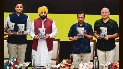 (From left) Author Jasmine Shah, Punjab chief minister Bhagwant Mann, AAP national convener Arvind Kejrwal and former Delhi chief minister Manish Sisodia during the launch of the Punjabi edition of Shah’s book ‘Kejriwal Model’. (Sanjeev Sharma/HT) (From left) Author Jasmine Shah, Punjab chief minister Bhagwant Mann, AAP national convener Arvind Kejrwal and former Delhi chief minister Manish Sisodia during the launch of the Punjabi edition of Shah’s book ‘Kejriwal Model’. (Sanjeev Sharma/HT)
