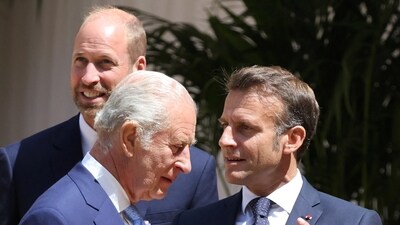 Britain's King Charles III speaks with France's President Emmanuel Macron (R), next to Britain's Prince William, Prince of Wales (L), during a ceremonial welcome at Windsor Castle, in Windsor west of London, on July 8, 2025, on the first day of a three-day state visit to Britain. LUDOVIC MARIN/Pool via REUTERS (via REUTERS)