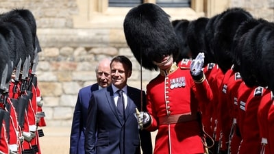 Britain's King Charles III and France's President Emmanuel Macron inspect the Guard of Honour during a ceremonial welcome at Windsor Castle, in Windsor west of London, on July 8, 2025, on the first day of a three-day state visit to Britain. LUDOVIC MARIN/Pool via REUTERS (via REUTERS)