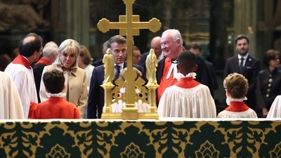 France's President Emmanuel Macron and his wife Brigitte Macron are guided by The Reverend David Stanton (R) during a visit to Westminster Abbey in London, on July 8, 2025, on the first day of a three-day state visit to Britain. French President Emmanuel Macron began a three-day state visit to Britain on Tuesday, which saw him address parliament and try to rekindle a purportedly warm relationship with King Charles III. (Photo by Gonzalo Fuentes / POOL / AFP) (AFP) France's President Emmanuel Macron and his wife Brigitte Macron are guided by The Reverend David Stanton (R) during a visit to Westminster Abbey in London, on July 8, 2025, on the first day of a three-day state visit to Britain. French President Emmanuel Macron began a three-day state visit to Britain on Tuesday, which saw him address parliament and try to rekindle a purportedly warm relationship with King Charles III. (Photo by Gonzalo Fuentes / POOL / AFP) (AFP)
