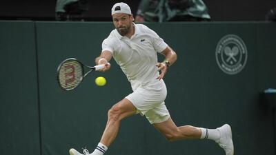 Bulgaria's Grigor had to quit with an injured pectoral muscle against Italy's Jannik Sinner at the Wimbledon Tennis Championships in London. (AP) Bulgaria's Grigor had to quit with an injured pectoral muscle against Italy's Jannik Sinner at the Wimbledon Tennis Championships in London. (AP)