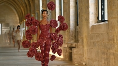 Rapper Cardi B also made an appearance at the fashion event dressed in a red rose gown complete with rose installations, similar to the ones in the image. (AFP) Rapper Cardi B also made an appearance at the fashion event dressed in a red rose gown complete with rose installations, similar to the ones in the image. (AFP)