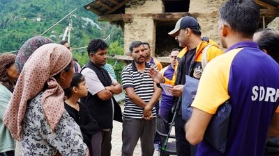 NDRF personnel interact with villagers at the cloudburst-affected areas to gather information on additional requirements and unmet needs, in Mandi on Saturday. (ANI) NDRF personnel interact with villagers at the cloudburst-affected areas to gather information on additional requirements and unmet needs, in Mandi on Saturday. (ANI)