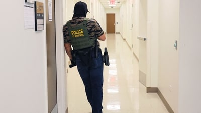 A federal agent waits in the hall at immigration court in the Ted Weiss Federal Building on July 07, 2025 in New York City. (Getty Images via AFP) A federal agent waits in the hall at immigration court in the Ted Weiss Federal Building on July 07, 2025 in New York City. (Getty Images via AFP)