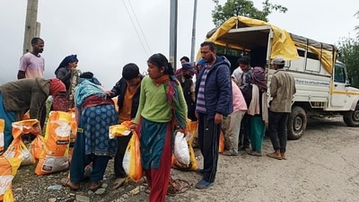 People rush to receive relief materials in disaster affected areas in Mandi, Himachal Pradesh. (ANI) People rush to receive relief materials in disaster affected areas in Mandi, Himachal Pradesh. (ANI)