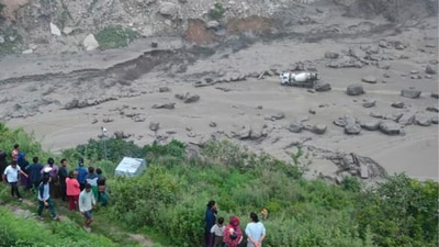 The continuous monsoon rainfall in China on Monday night triggered a flood in the Bhotekoshi River in Nepal. (Nepal Army (via AP))