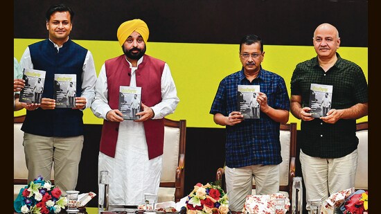 (From left) Author Jasmine Shah, Punjab chief minister Bhagwant Mann, AAP national convener Arvind Kejrwal and former Delhi chief minister Manish Sisodia during the launch of the Punjabi edition of Shah’s book ‘Kejriwal Model’. (Sanjeev Sharma/HT)