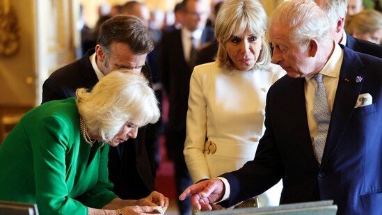 France's President Emmanuel Macron and his wife Brigitte Macron, alongside Britain's King Charles III and Britain's Queen Camilla, view an exhibition of art from the Royal Collection at Windsor Castle, in Windsor west of London, on July 8, 2025, on the first day of a three-day state visit to Britain. LUDOVIC MARIN/Pool via REUTERS(via REUTERS)