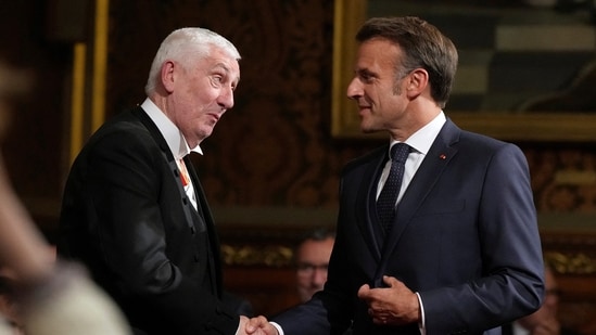 French President Emmanuel Macron shakes hands with the Speaker of the House of Commons Lindsay Hoyle after addressing parliament in the Palace of Westminster, London, Tuesday, July 8, 2025. Alastair Grant/Pool via REUTERS(via REUTERS)