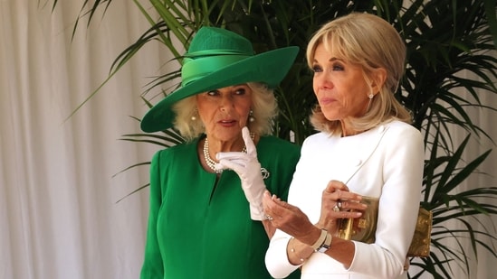 France's President's wife Brigitte Macron (R) and Britain's Queen Camilla stand during a ceremonial welcome at Windsor Castle, in Windsor west of London, on July 8, 2025, on the first day of a three-day state visit to Britain.(AFP)
