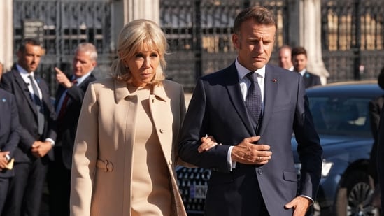 France's President Emmanuel Macron and his wife Brigitte Macron arrive to attend a ceremony at the statue of war-time Prime Minister Winston Churchill, in Parliament Square, central London on July 8, 2025, on the first day of a three-day state visit to Britain.(AFP)