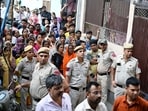 People and Police personnel at the site after a woman named Sonal and an infant (her friend's daughter) were found stabbed to death in the Majnu Ka Tila area, in New Delhi on Tuesday. People and Police personnel at the site after a woman named Sonal and an infant (her friend's daughter) were found stabbed to death in the Majnu Ka Tila area, in New Delhi on Tuesday.