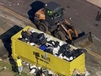 Trash is cleaned up at a drop-off site in Philadelphia as thousands of city workers remained on strike Tuesday. Trash is cleaned up at a drop-off site in Philadelphia as thousands of city workers remained on strike Tuesday.
