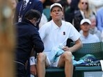 Jannik Sinner reacts as he receives medical treatment during his men's singles fourth round tennis match against Grigor Dimitrov on the eighth day of the 2025 Wimbledon Jannik Sinner reacts as he receives medical treatment during his men's singles fourth round tennis match against Grigor Dimitrov on the eighth day of the 2025 Wimbledon