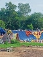 Temporary structures erected along major roadsides and (below) belongings of encroachers lying on footpath. (HT Photo)