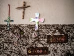 Crosses hang on a wall with flood marks at Camp Mystic, in the aftermath of deadly flooding in Kerr County.  REUTERS/Sergio Flores