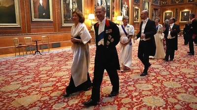 France's Ambassador to the United Kingdom Helene Duchene (L) and Britain's Prince Edward, Duke of Edinburgh arrive to attend a State Banquet at Windsor Castle, west of London. (AFP) France's Ambassador to the United Kingdom Helene Duchene (L) and Britain's Prince Edward, Duke of Edinburgh arrive to attend a State Banquet at Windsor Castle, west of London. (AFP)