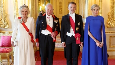 King Charles III, France's President Emmanuel Macron and his wife Brigitte Macron pose for a photo as they attend a State Banquet at Windsor Castle, west of London, on July 8, 2025, on the first day of a three-day state visit to by France's President Emmanuel Macron. French President Emmanuel Macron began a three-day state visit to Britain on Tuesday, which saw him address parliament and try to rekindle a purportedly warm relationship with King Charles III. (Photo by Chris Jackson / POOL / AFP) (AFP) King Charles III, France's President Emmanuel Macron and his wife Brigitte Macron pose for a photo as they attend a State Banquet at Windsor Castle, west of London, on July 8, 2025, on the first day of a three-day state visit to by France's President Emmanuel Macron. French President Emmanuel Macron began a three-day state visit to Britain on Tuesday, which saw him address parliament and try to rekindle a purportedly warm relationship with King Charles III. (Photo by Chris Jackson / POOL / AFP) (AFP)