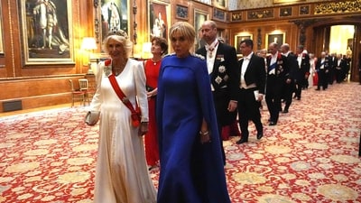 The Queen wore the Belgian Sapphire Tiara, which she first donned during the Republic of South Africa's State Banquet for President Cyril Ramaphosa in November 2022. She paired the sapphire bracelet, earrings, and necklace from Queen Elizabeth's collection with the tiara. Camilla also donned the new royal order of King Charles and an evening gown designed by Fiona Clare using silk crepe and ivory. (AFP) The Queen wore the Belgian Sapphire Tiara, which she first donned during the Republic of South Africa's State Banquet for President Cyril Ramaphosa in November 2022. She paired the sapphire bracelet, earrings, and necklace from Queen Elizabeth's collection with the tiara. Camilla also donned the new royal order of King Charles and an evening gown designed by Fiona Clare using silk crepe and ivory. (AFP)