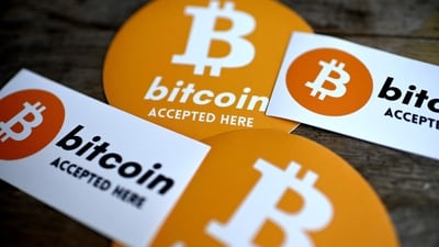 This photograph shows Bitcoin stickers displayed at the microbrewery and bar La Fracasse, in Talence (AFP) This photograph shows Bitcoin stickers displayed at the microbrewery and bar La Fracasse, in Talence (AFP)