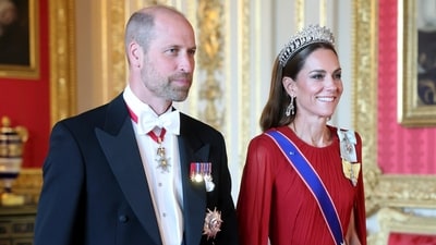 The Princess of Wales wore the Cambridge Lover's Knot Tiara, which was renownedly worn by her late mother-in-law. She also donned Greville Chandelier Earrings from the jewelry collection of the late Queen Elizabeth II. She completed the look with Princess Diana's three-strand pearl bracelet by Nigel Milne and a number of prestigious royal emblems, such as the Royal Family Order of King Charles III and the Royal Order of Queen Elizabeth II. (AP) The Princess of Wales wore the Cambridge Lover's Knot Tiara, which was renownedly worn by her late mother-in-law. She also donned Greville Chandelier Earrings from the jewelry collection of the late Queen Elizabeth II. She completed the look with Princess Diana's three-strand pearl bracelet by Nigel Milne and a number of prestigious royal emblems, such as the Royal Family Order of King Charles III and the Royal Order of Queen Elizabeth II. (AP)
