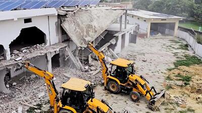 Bulldozer action under way in Balrampur’s Utraula area on the first day on Tuesday. (ANI PHOTO) Bulldozer action under way in Balrampur’s Utraula area on the first day on Tuesday. (ANI PHOTO)