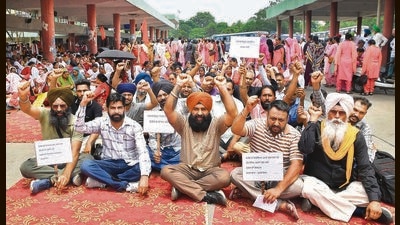 Contractual workers of Punjab Roadways and PRTC protesting at the Ludhiana bus stand on Wednesday. (Manish/HT) Contractual workers of Punjab Roadways and PRTC protesting at the Ludhiana bus stand on Wednesday. (Manish/HT)