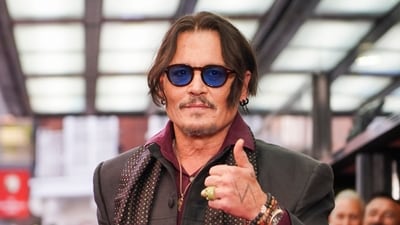 Johnny looked dashing as he graced the red carpet at the premiere at The Curzon Mayfair wearing his signature sunglasses and scarf while in an all-black tailored pants and jacket. (AP) Johnny looked dashing as he graced the red carpet at the premiere at The Curzon Mayfair wearing his signature sunglasses and scarf while in an all-black tailored pants and jacket. (AP)