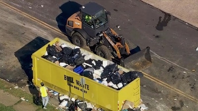 Trash is cleaned up at a drop-off site in Philadelphia as thousands of city workers remained on strike Tuesday. (AP) Trash is cleaned up at a drop-off site in Philadelphia as thousands of city workers remained on strike Tuesday. (AP)