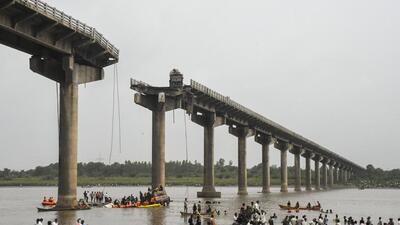 Rescue operation underway after vehicles fell into the Mahisagar River. (PTI) Rescue operation underway after vehicles fell into the Mahisagar River. (PTI)