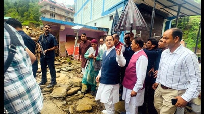 Union minister Jagat Parkash Nadda inspecting the disaster- affected areas of Mandi district in Himachal Pradesh on Wednesday. (Birbal Sharma/HT) Union minister Jagat Parkash Nadda inspecting the disaster- affected areas of Mandi district in Himachal Pradesh on Wednesday. (Birbal Sharma/HT)