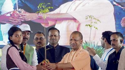 Uttar Pradesh chief minister Yogi Adityanath and others during an event under the ‘Ek Ped Maa Ke Naam’ campaign, in Azamgarh district. (PTI PHOTO) Uttar Pradesh chief minister Yogi Adityanath and others during an event under the ‘Ek Ped Maa Ke Naam’ campaign, in Azamgarh district. (PTI PHOTO)