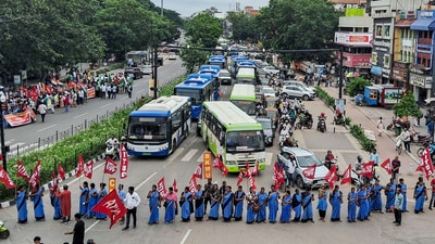 Members of various trade unions block a road during a 'Bharat Bandh' (a nationwide general strike) call by a forum of 10 central trade unions and their associates, in Bhubaneswar on Wednesday. (ANI)