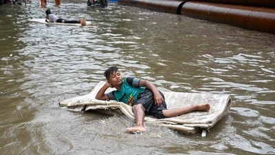 Despite the disruptions, many in the city welcomed the downpour. Children played in the puddles, street vendors rejoiced at increased footfall, and the air was markedly cooler and fresher after the showers. (HT Photo/Samir Jana) Despite the disruptions, many in the city welcomed the downpour. Children played in the puddles, street vendors rejoiced at increased footfall, and the air was markedly cooler and fresher after the showers. (HT Photo/Samir Jana)