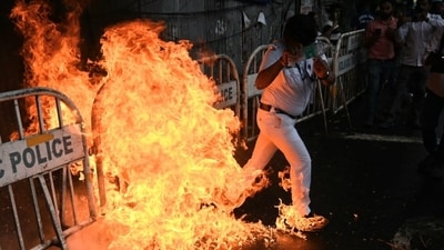 Police personnel extinguishing a burning effigy as members of Central Trade Unions take out a rally in support of Nationwide General Strike against Union Government's four Labour Code in Kolkata on July 09, 2025. (HT Photo/Samir Jana) Police personnel extinguishing a burning effigy as members of Central Trade Unions take out a rally in support of Nationwide General Strike against Union Government's four Labour Code in Kolkata on July 09, 2025. (HT Photo/Samir Jana)