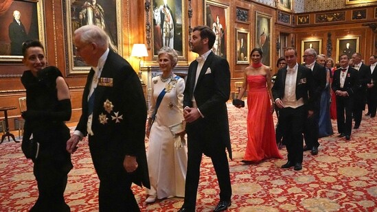 Lebanese-born Paris-based architect Lina Ghotmeh (L), Britain's Prince Richard, Duke of Gloucester (2L), Britain's Birgitte, Duchess of Gloucester (3L) and France's Tristan Bromet arrive to attend a State Banquet at Windsor Castle, west of London.(AFP)