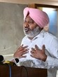 Punjab finance minister interacting with the media after the adjournment of the first sitting of the two-day special session of the Punjab assembly in Chandigarh on Thursday. (Ravi Kumar/HT)