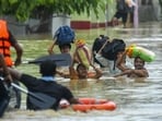 Rescue personnel assist locals in moving to a safer place through a rescue boat in a flood-affected area amid heavy rainfall on the outskirts of Agartala, Tripura. Rescue personnel assist locals in moving to a safer place through a rescue boat in a flood-affected area amid heavy rainfall on the outskirts of Agartala, Tripura.