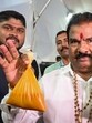 Sanjay Gaikwad holding up packets of daal (Raju Shinde/ HT Photo)