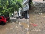 A local resident's sarcastic post on X, featuring photos of the cratered road, has gone viral. A local resident's sarcastic post on X, featuring photos of the cratered road, has gone viral.
