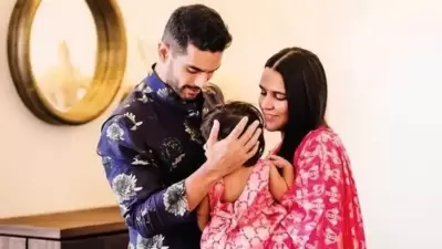 Neha Dhupia with her daughter Mehr and husband Angad Bedi.