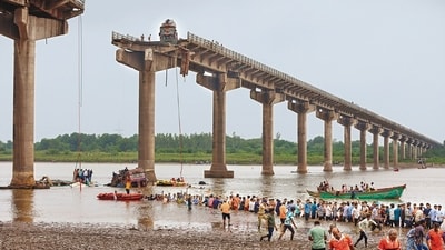 A slab of the Gambhira-Mujpur bridge collapsed at around 7 am on Wednesday. (AP) A slab of the Gambhira-Mujpur bridge collapsed at around 7 am on Wednesday. (AP)