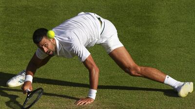 Novak Djokovic returns to Flavio Cobolli during their Wimbledon quarter-final. (AP) Novak Djokovic returns to Flavio Cobolli during their Wimbledon quarter-final. (AP)