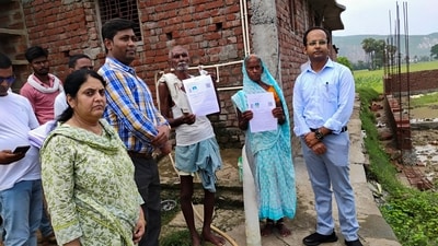 Election officials handing over enumeration forms to voters ahead of the Bihar assembly elections 2025 due in October-November. (X/@CEOBihar) Election officials handing over enumeration forms to voters ahead of the Bihar assembly elections 2025 due in October-November. (X/@CEOBihar)