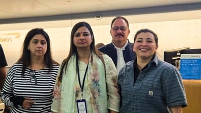 A team of CBI officials returning on board American Airlines flight with fugitive of 25-years Monika Kapoor (extreme left) after her extradition from the US. (PTI) A team of CBI officials returning on board American Airlines flight with fugitive of 25-years Monika Kapoor (extreme left) after her extradition from the US. (PTI)