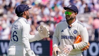 India's Dhruv Jurel, left, greets vice captain Rishabh Pant as the former arrives on the field after the latter's injury on the first day of the third test cricket match between India and England (PTI) India's Dhruv Jurel, left, greets vice captain Rishabh Pant as the former arrives on the field after the latter's injury on the first day of the third test cricket match between India and England (PTI)