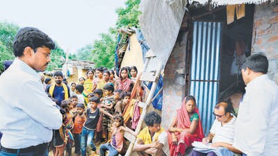 Patna District Magistrate Tyagrajan SM inspecting Mahadalit Tola of Shrirampur Panchayat of Korhar village of Bihta block and the progress in the distribution and collection of counting forms under the special intensive revision campaign of the electoral list at Bihta in Patna, Bihar, on July 2. (Santosh Kumar/HT)
